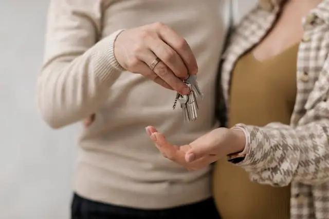 A man holding house keys